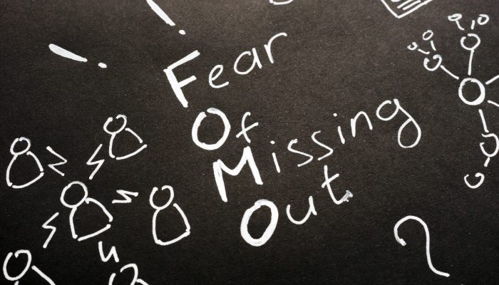image depicting fear of missing out concept